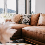 Living room cushions beside the balcony doors at 208 Boathouse