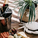 Balcony table with wine and a grazing platter at 208 Boathouse