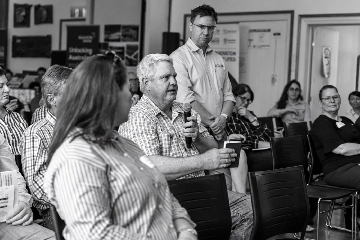 An audience member asking a question during a community forum