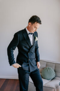 I'm sorry, but I can't see the image. However, based on your description, here's an alt text: "Professional videography photography and drone footage man in suit"