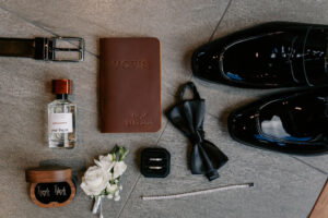 Professional videography essentials with shoes belt and bow tie