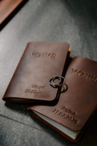 Professional videography wedding vow books and rings display