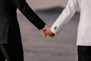 Professional videography photography and drone footage couple holding hands