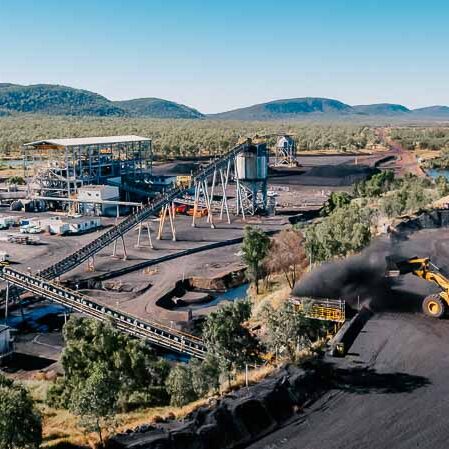 Coal belt being loaded by shovel truck on mine site