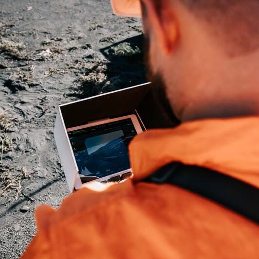 overshoulder of screen with man in ppe
